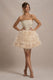 Peaches | Champagne Strapless Mini Jurk Met Volumineuze Veren Zoom